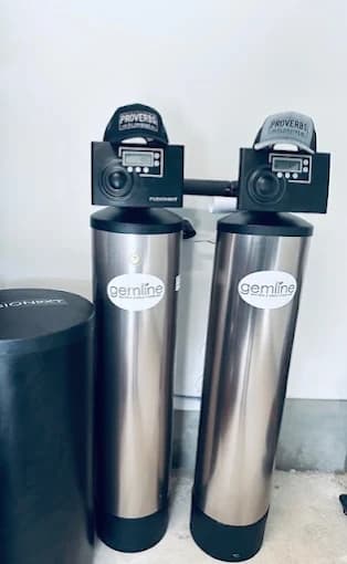 Pair of Gemline water softener tanks with FusionXT control heads branded Proverbs Plumbing